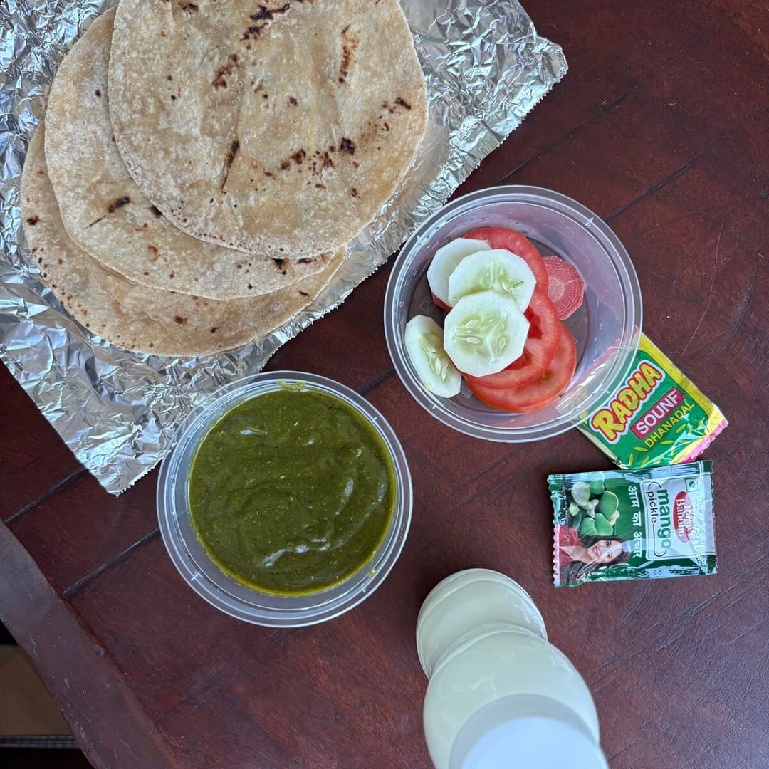 DabbaLicious tiffin with rotis, sabzi, salad, chaas and pickle